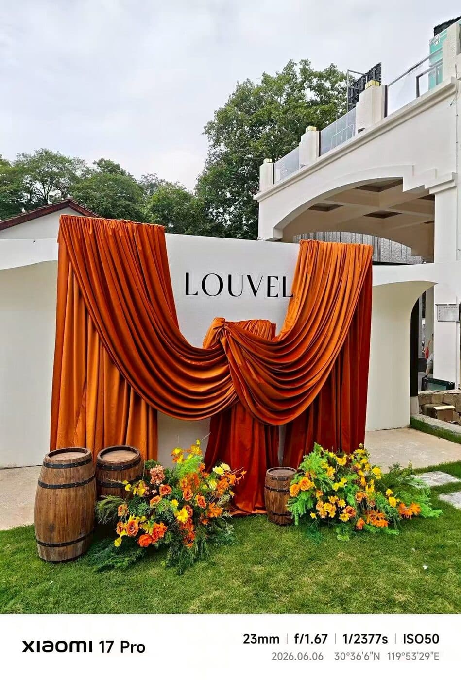 LOUVEL signage draped in amber velvet at the venue entrance